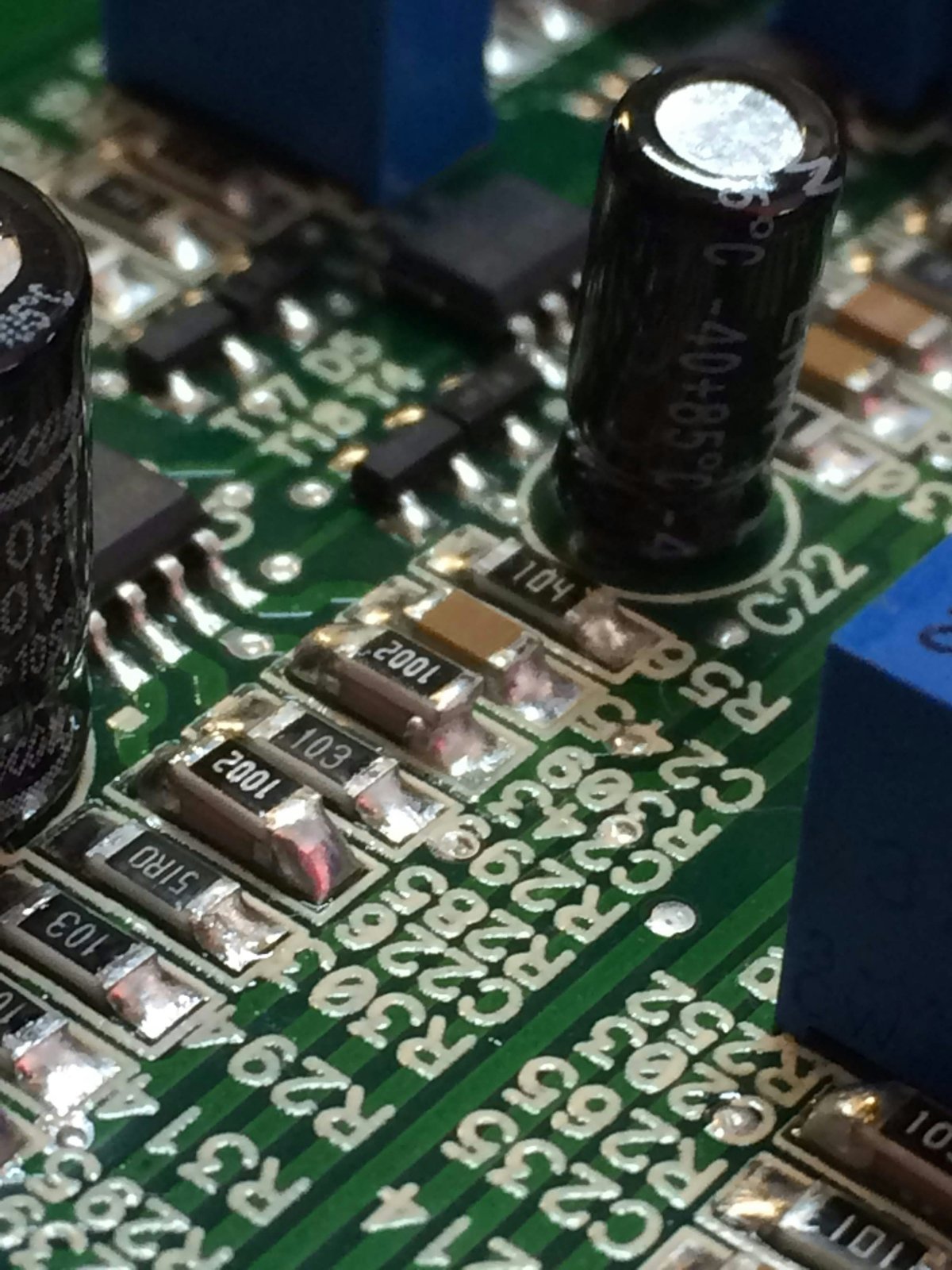 Close-up of circuit board with SMD components, dark background, precision soldering at WEBUILDPRO Bangalore