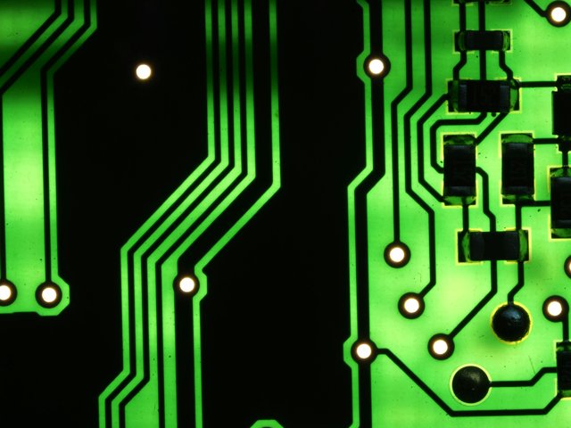 Electronic circuit board with SMD components, close macro shot, dark background, WEBUILDPRO Bangalore